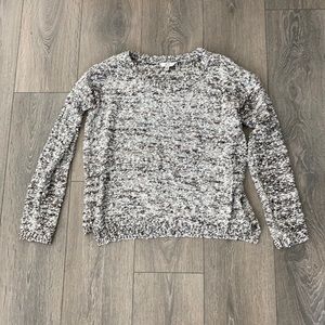 black, white, and rose gold sweater